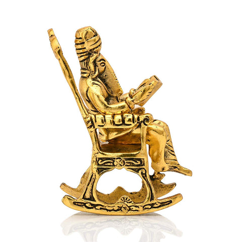 chair ganesha, reading ramayan ganesh statue, ganesha idol, ganesh idol for home, ganesh idol for gift, ganesh idol online, ganesh murti, ganesh idol, ganesha idol for gift