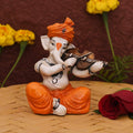 Showpiece of musician Lord Ganesha playing violin Statue