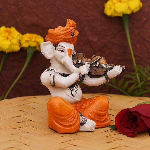 Showpiece of musician Lord Ganesha playing violin Statue