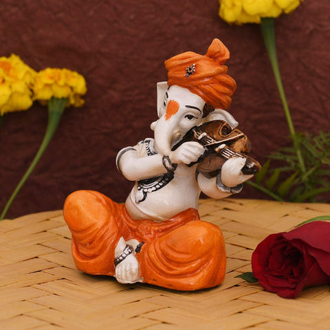 Showpiece of musician Lord Ganesha playing violin Statue