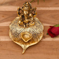 Decorative Ganesha Idol On Leaf Diya Oil Lamp Stand Showpiece