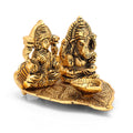 Metal  Lakshmi Ganesha Idol Sitting On Leaf With Diya Oil Lamp Lgbs169