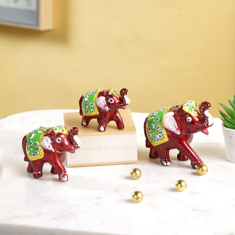 Miniature Colorful elephant family Trunk up