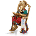 Ganesh Idol Sitting on Chair and Reading Ramayana Showpiece