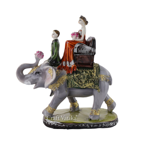 Resin Couple Sitting on Elephant Decorative Showpiece